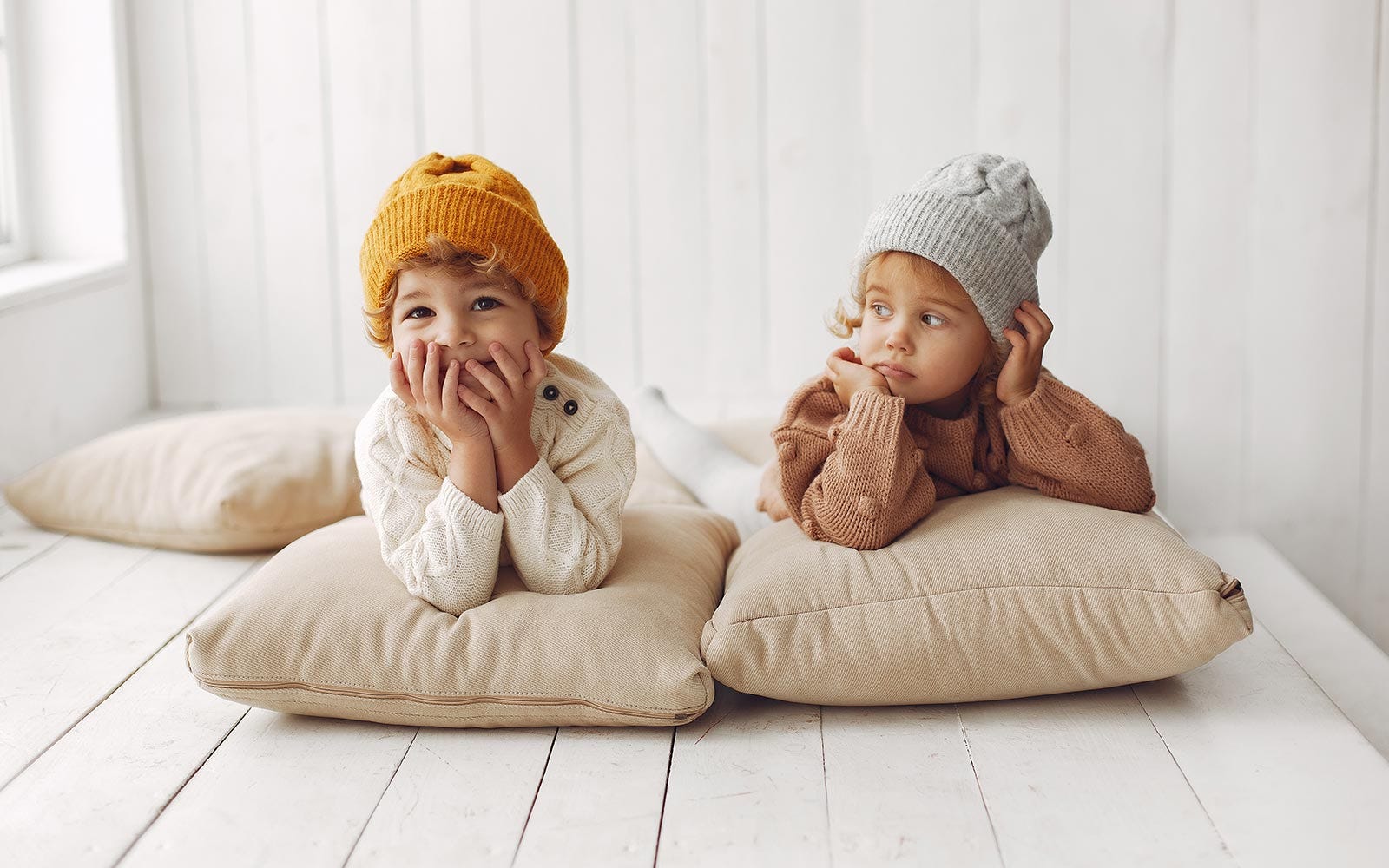 children relaxing in warm winter clothes