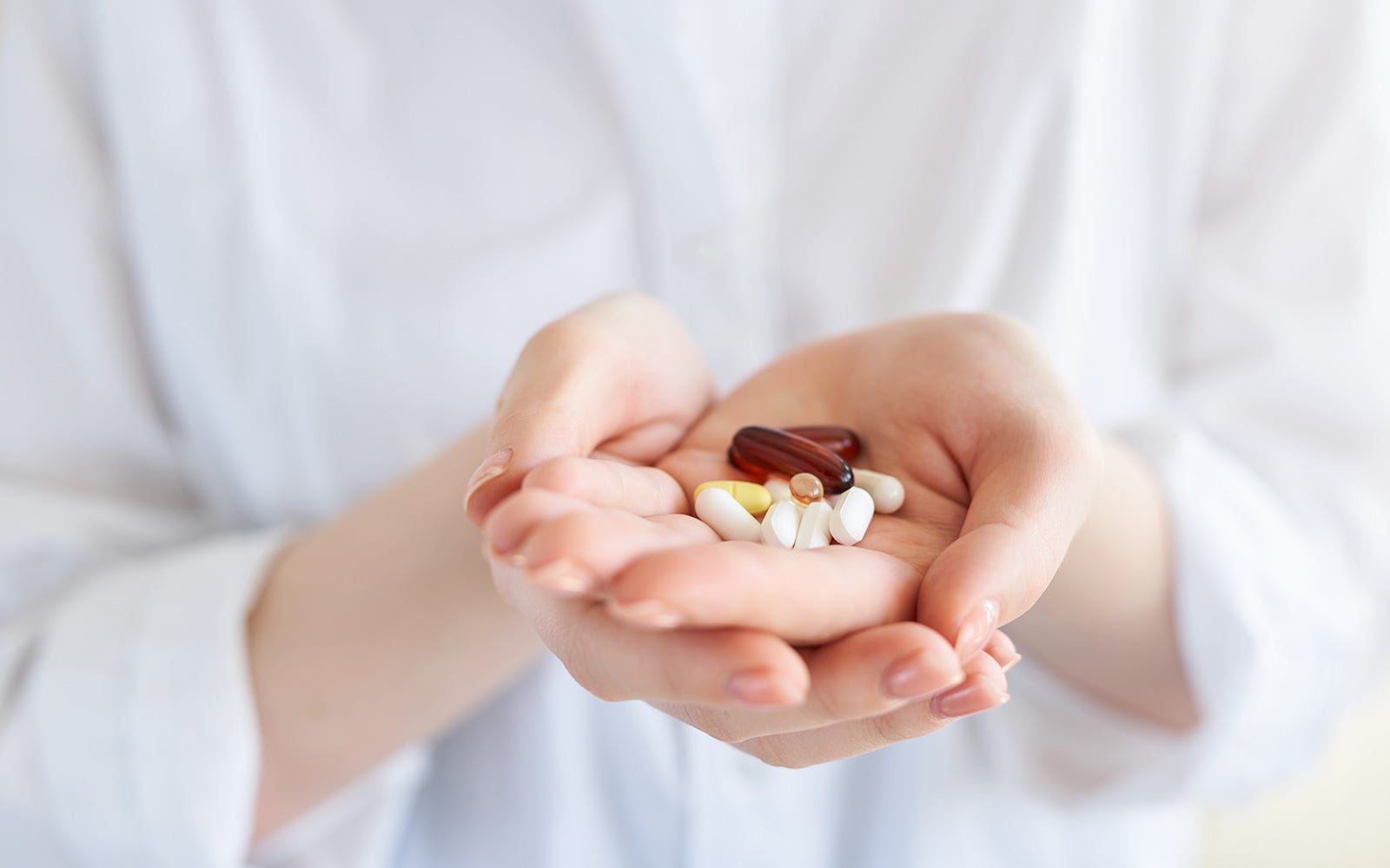 woman holding supplements